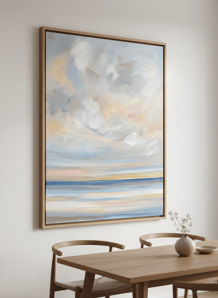 Wall art styled above a dining table in a contemporary home