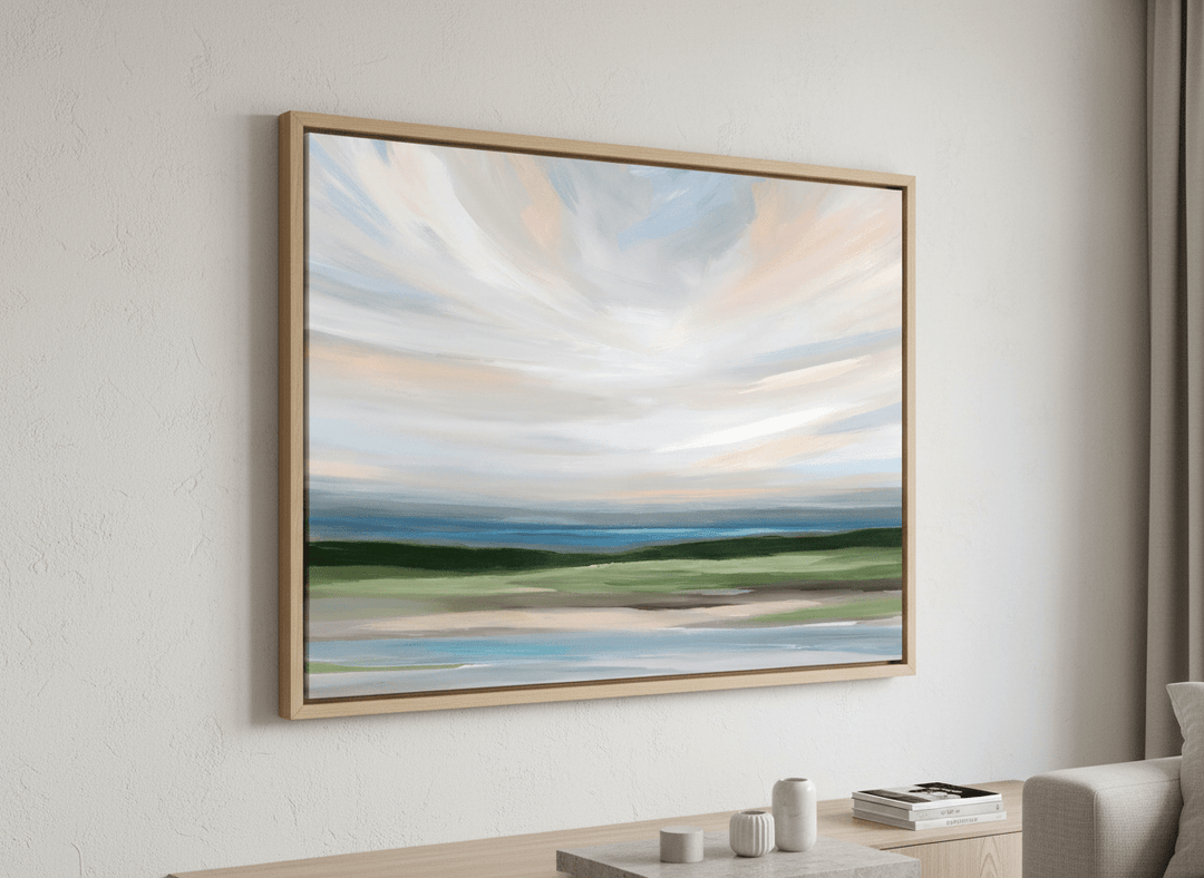 Modern wall art styled above a sofa in a neutral living room