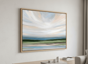 Modern wall art styled above a sofa in a neutral living room