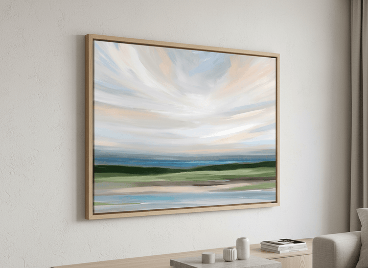 Modern wall art styled above a sofa in a neutral living room