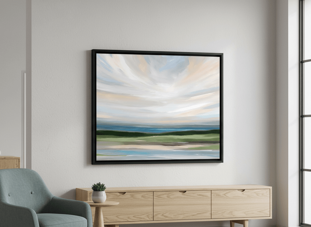 Modern wall art styled above a sofa in a neutral living room