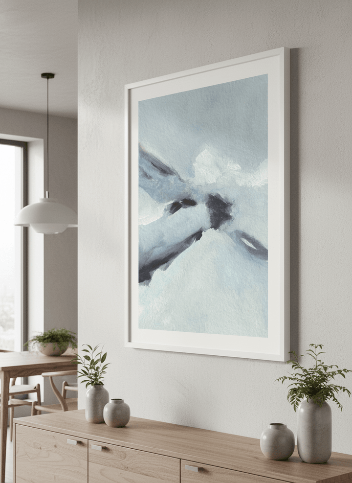 Wall art styled above a dining table in a contemporary home