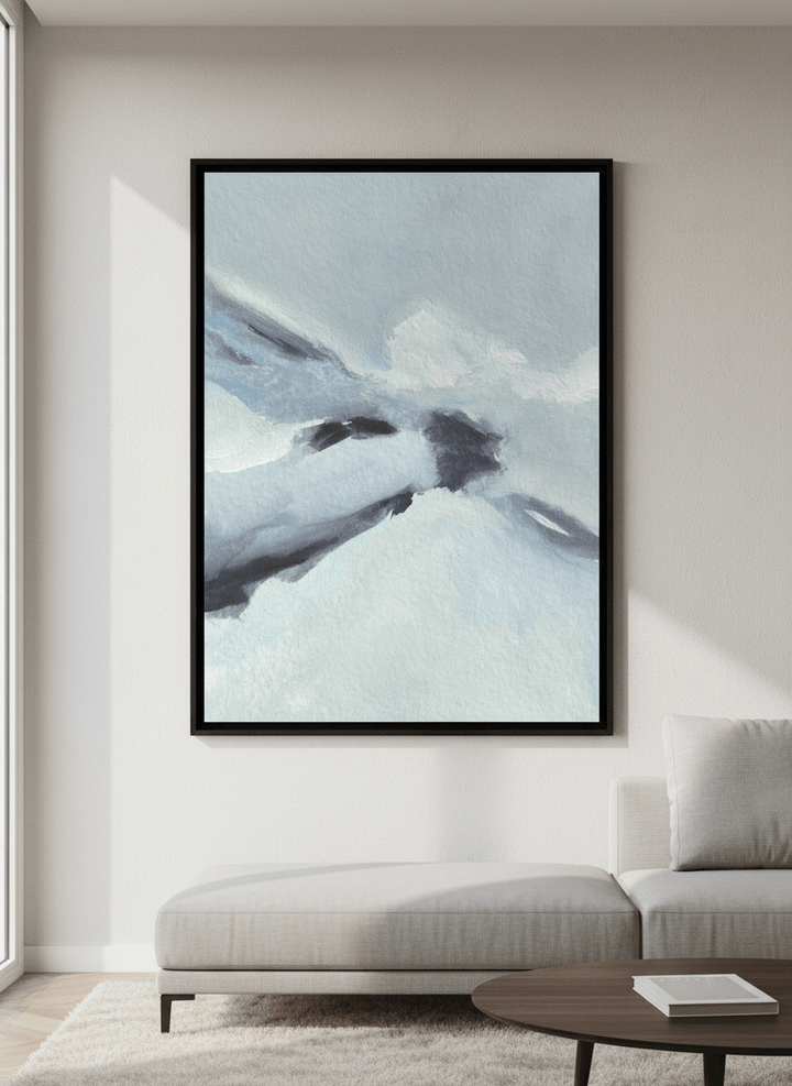 Modern wall art styled above a sofa in a neutral living room