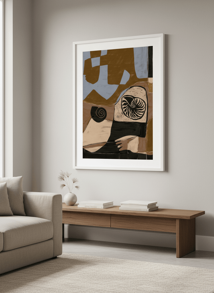 Modern wall art styled above a sofa in a neutral living room