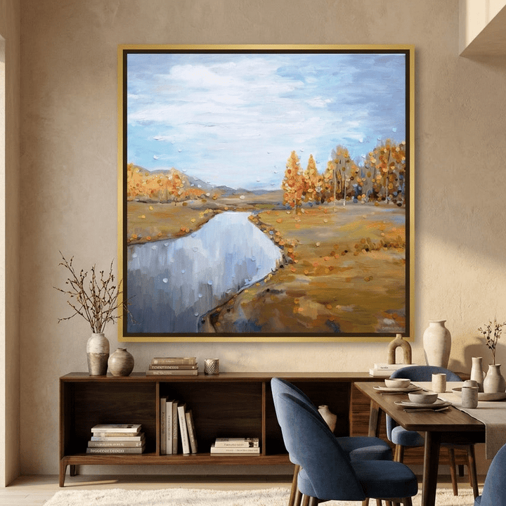 Oversized statement canvas wall art with a gold leaf surround styled in a luxe interior