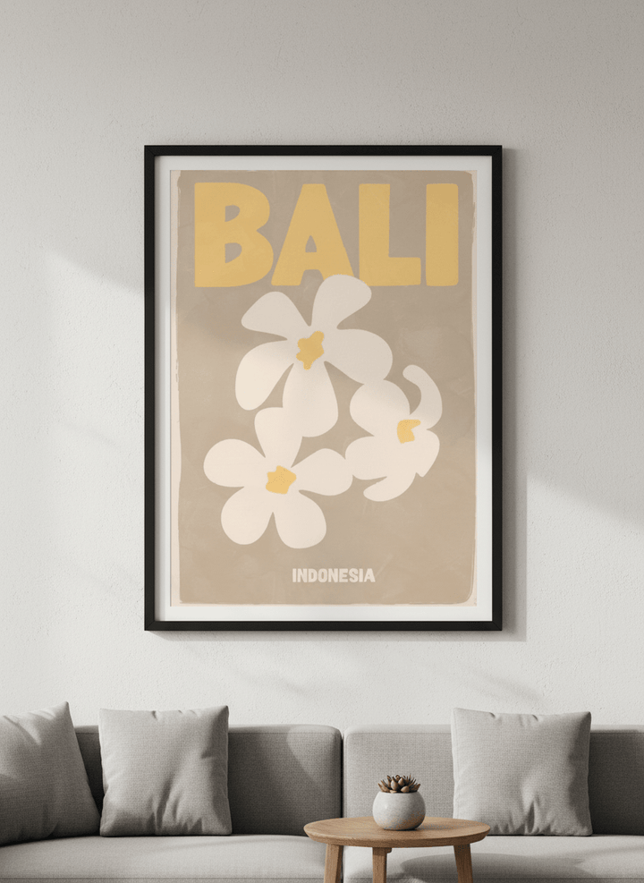 Modern wall art styled above a sofa in a neutral living room