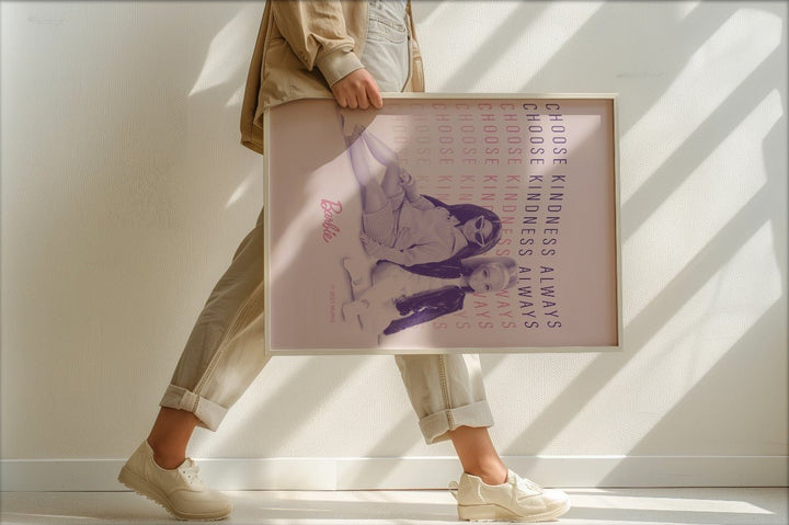 Person holding a poster with text and images, standing in a well-lit room.