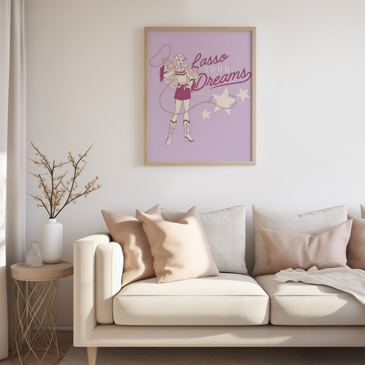 Artwork with a superhero design on a wall above a beige sofa.