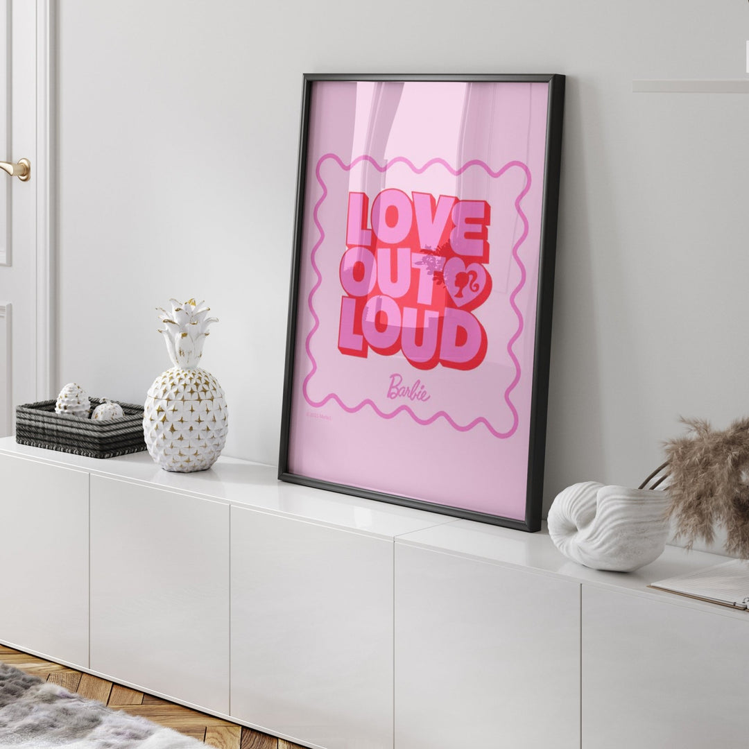 artwork with 'Love Out Loud' text on a white wall