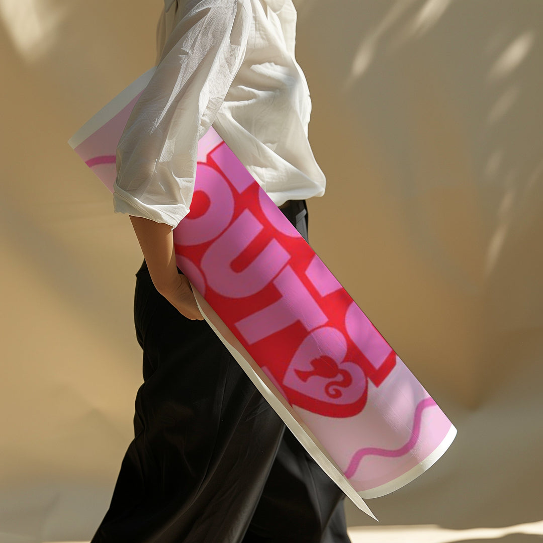 Person holding a pink and red 'Ruthie' product against a blurred background