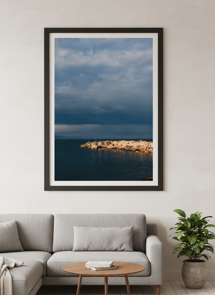 Modern wall art styled above a sofa in a neutral living room