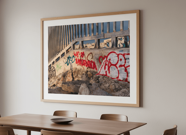 Wall art styled above a dining table in a contemporary home