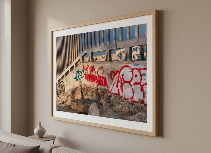 Modern wall art styled above a sofa in a neutral living room