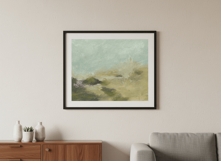 Modern wall art styled above a sofa in a neutral living room