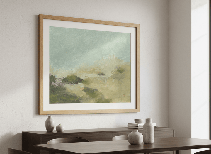 Wall art styled above a dining table in a contemporary home