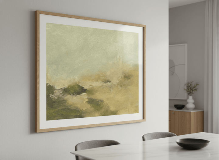 Wall art styled above a dining table in a contemporary home