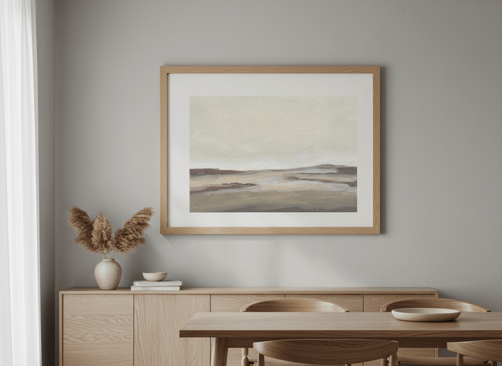 Wall art styled above a dining table in a contemporary home