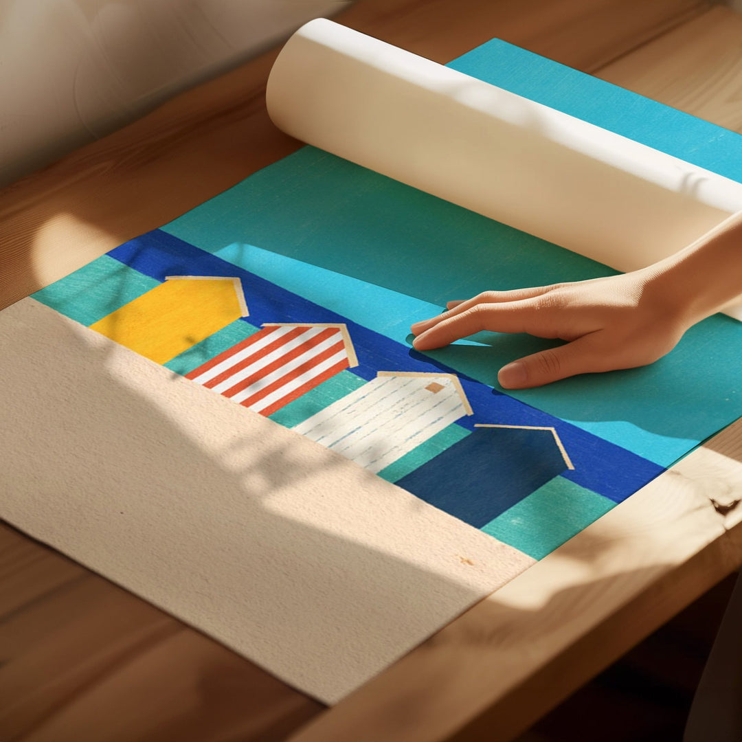Hand rolling out a colorful mat with geometric patterns on a wooden floor.