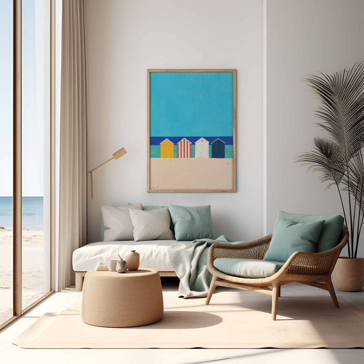 Modern living room with a beach-themed wall art and a view of the ocean.