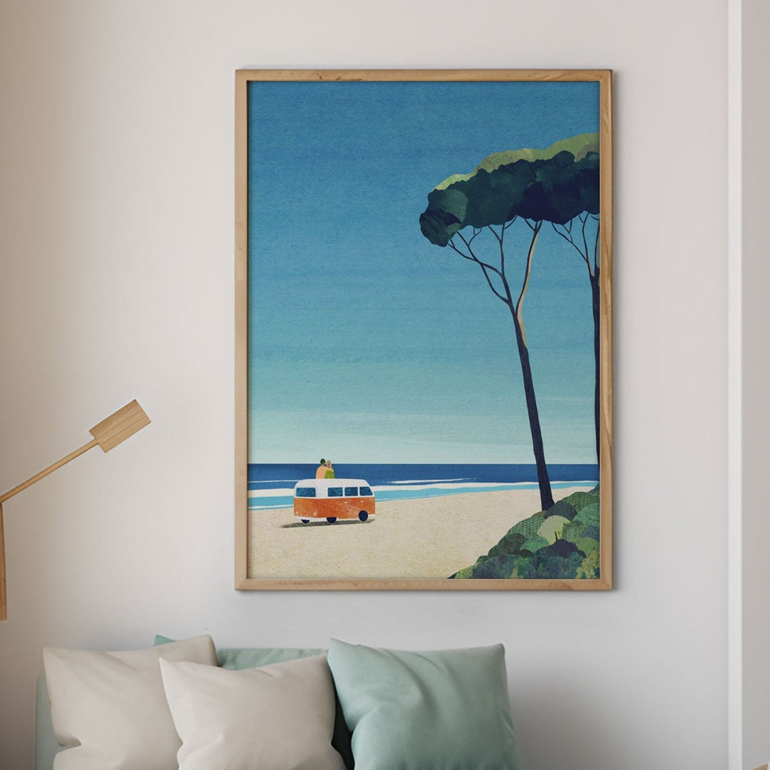 Modern living room with beach-themed artwork, furniture, and decor.