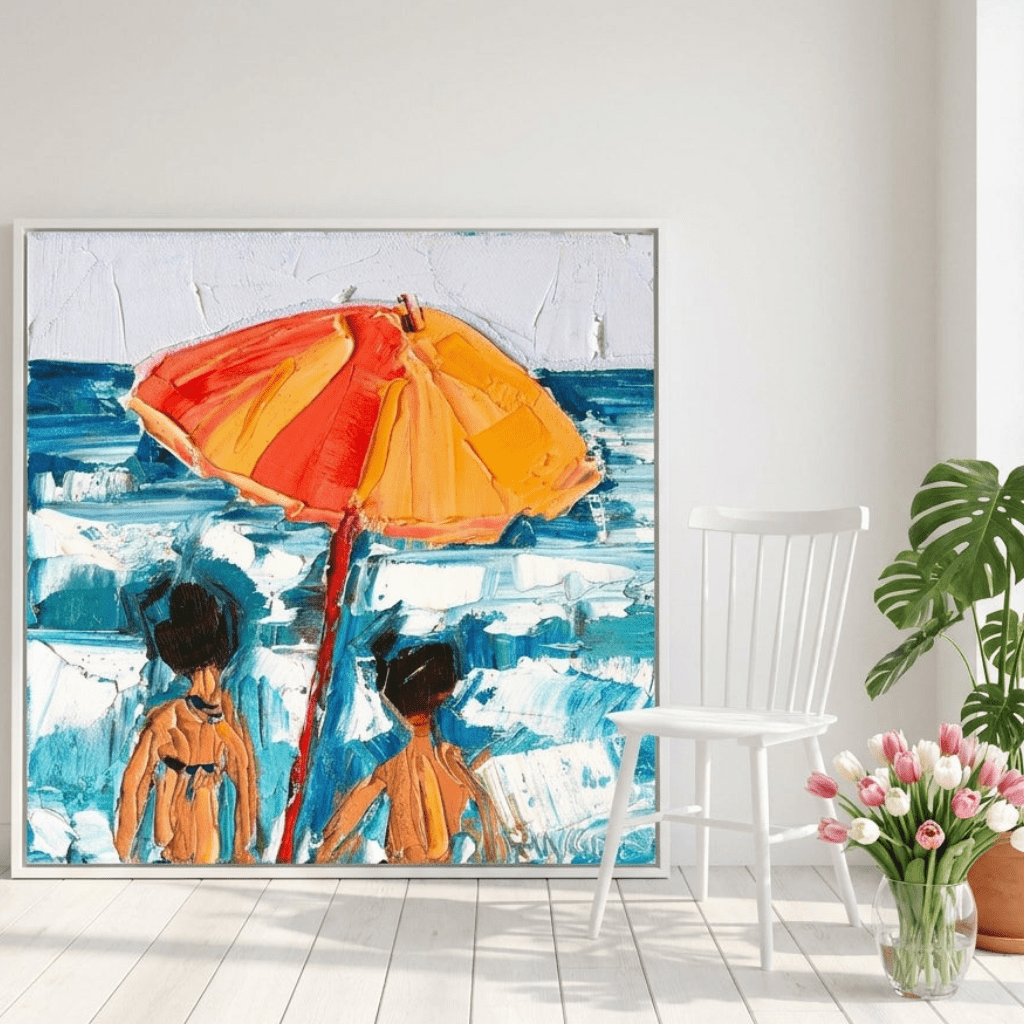 Oversized statement canvas wall art with a white surround leaning against the wall in a bright Scandinavian dining room