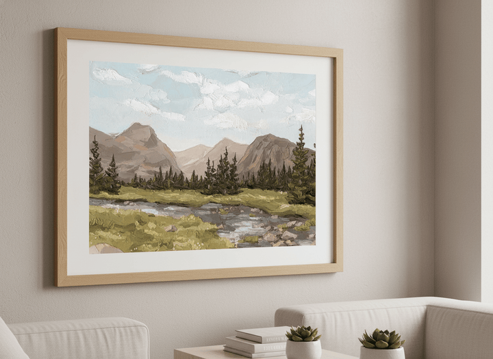 Modern wall art styled above a sofa in a neutral living room