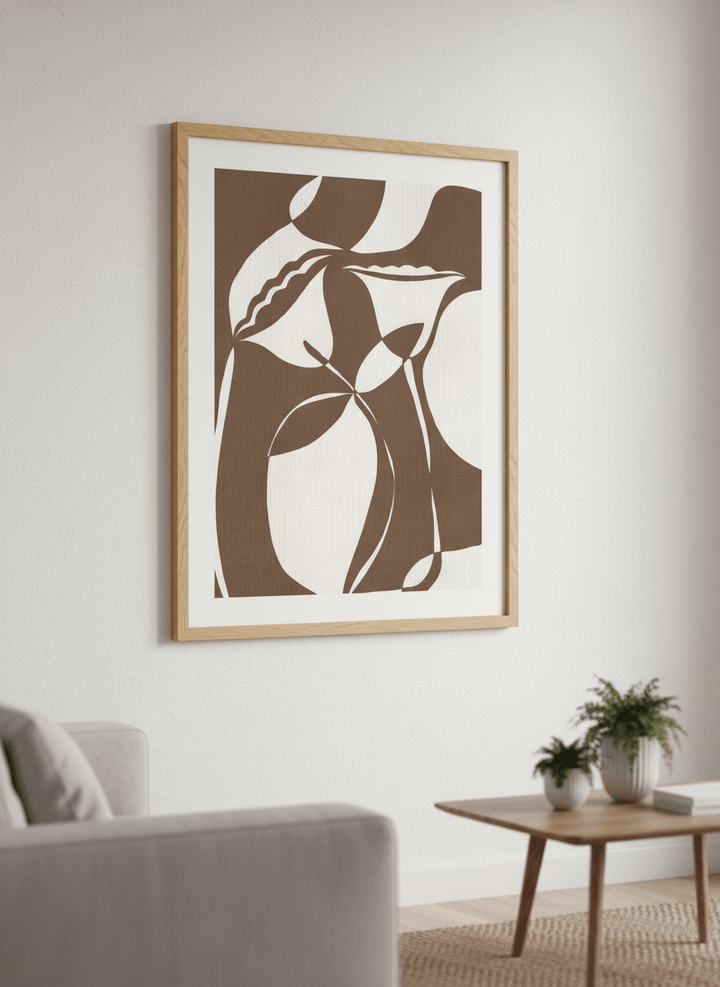 Modern wall art styled above a sofa in a neutral living room