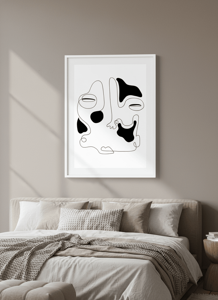 Minimalist artwork displayed in a calm, light-filled bedroom interior