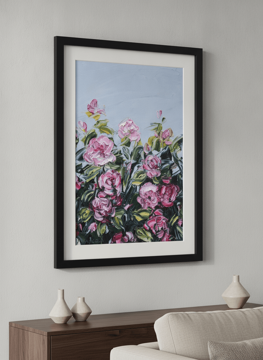 Modern wall art styled above a sofa in a neutral living room