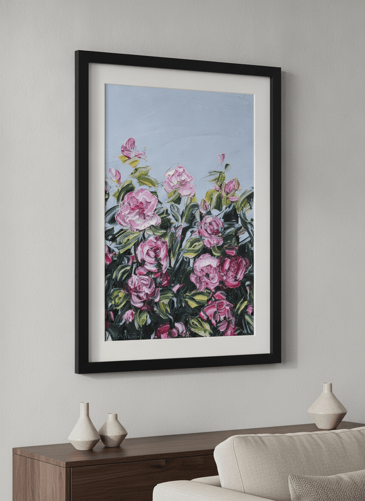 Modern wall art styled above a sofa in a neutral living room