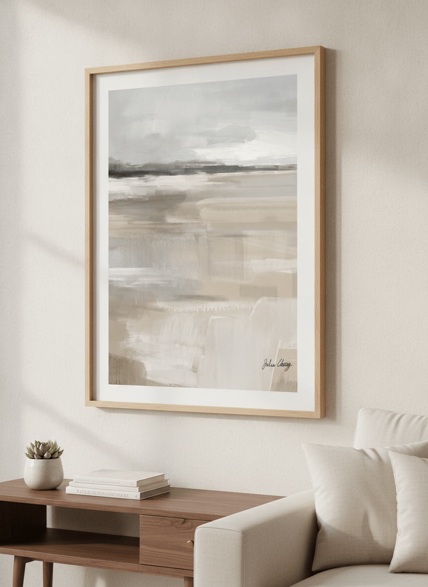 Modern wall art styled above a sofa in a neutral living room