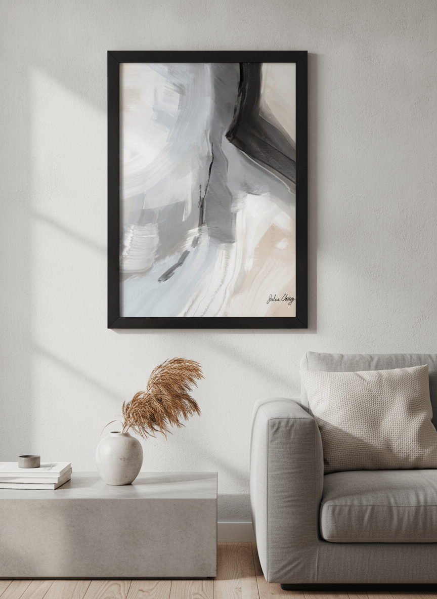 Modern wall art styled above a sofa in a neutral living room