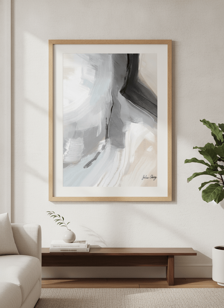 Modern wall art styled above a sofa in a neutral living room