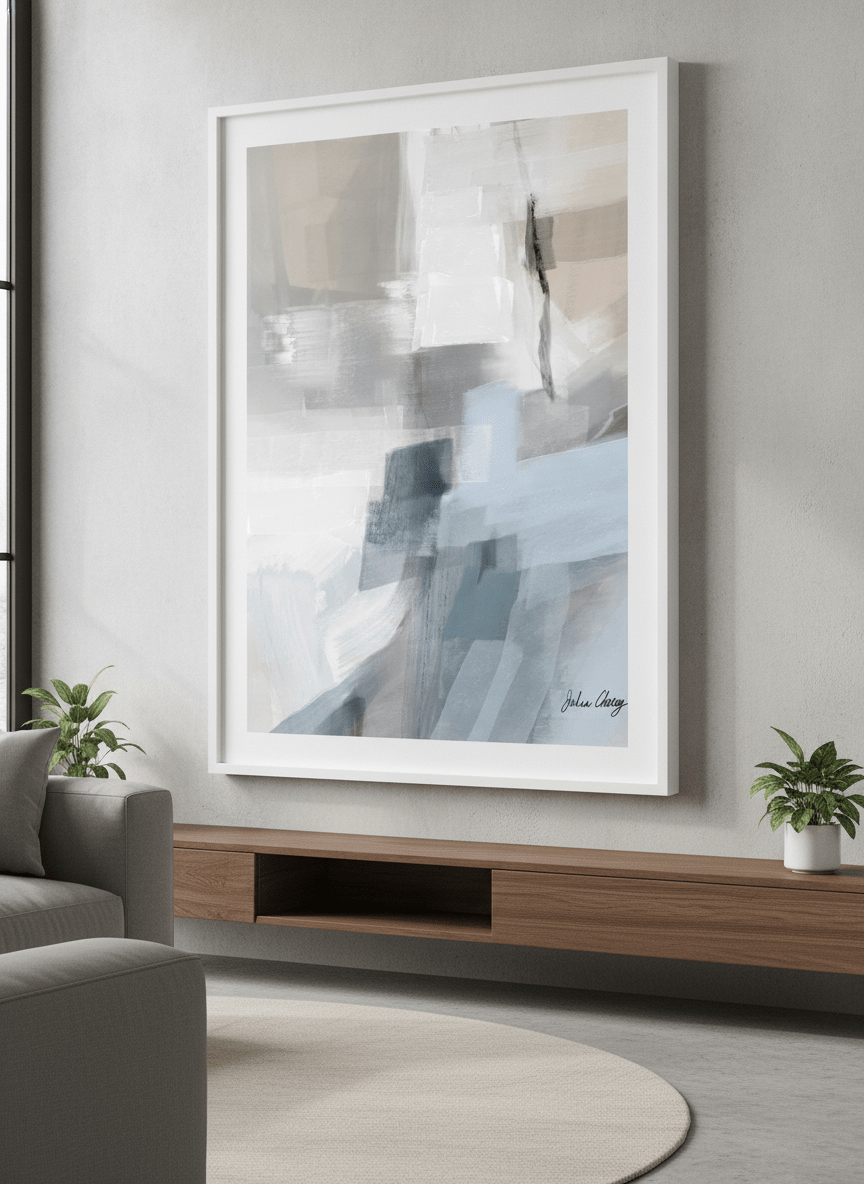 Modern wall art styled above a sofa in a neutral living room