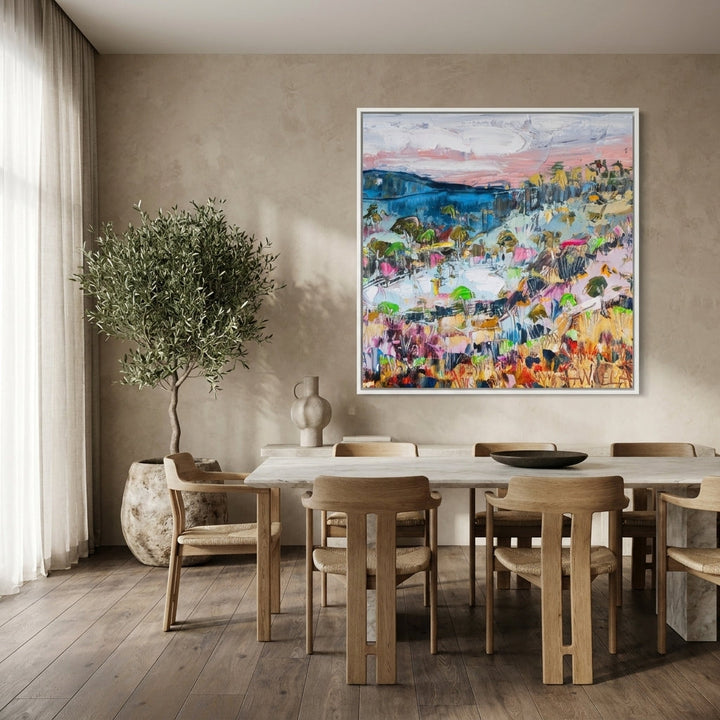 Oversized statement canvas wall art with a white surround styled on the wall in a luxe dining room