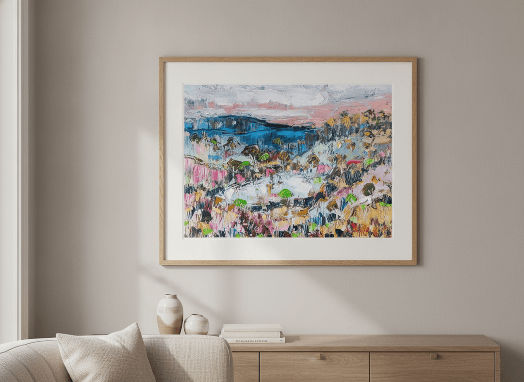 Modern wall art styled above a sofa in a neutral living room