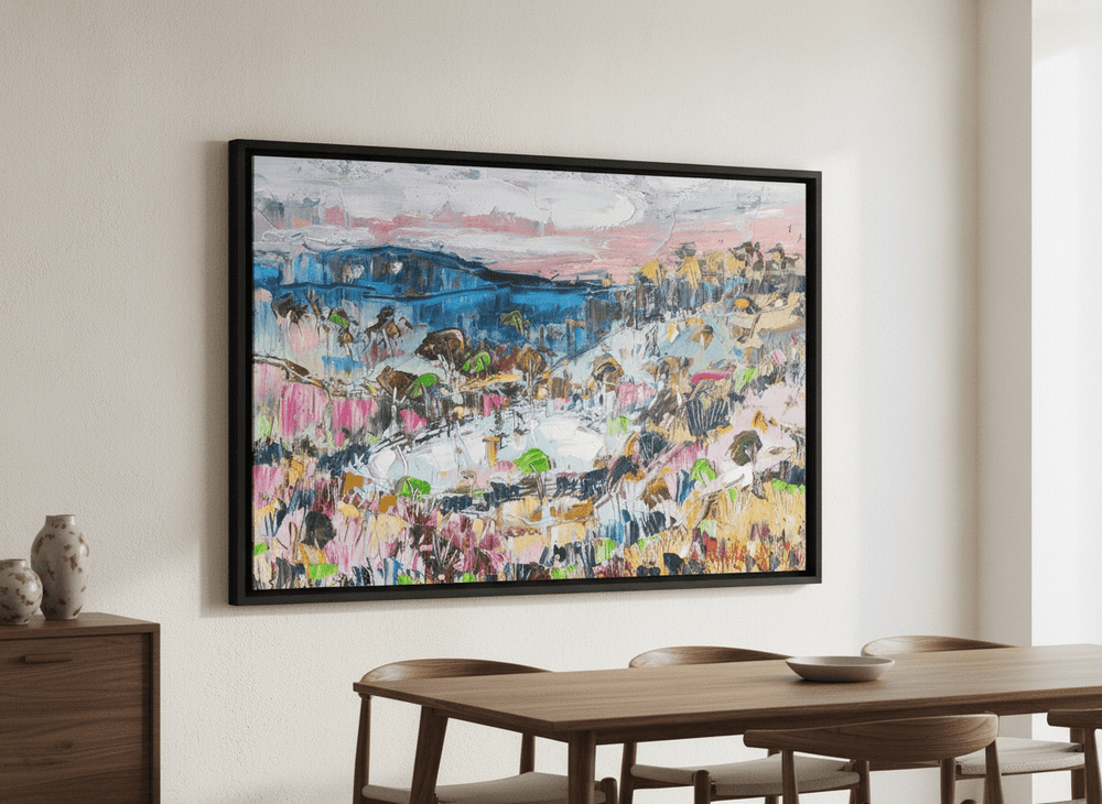 Wall art styled above a dining table in a contemporary home