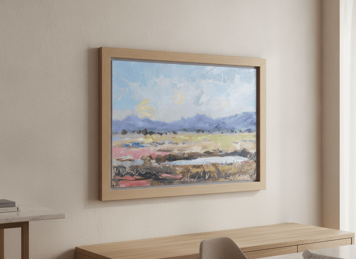 Wall art styled above a dining table in a contemporary home