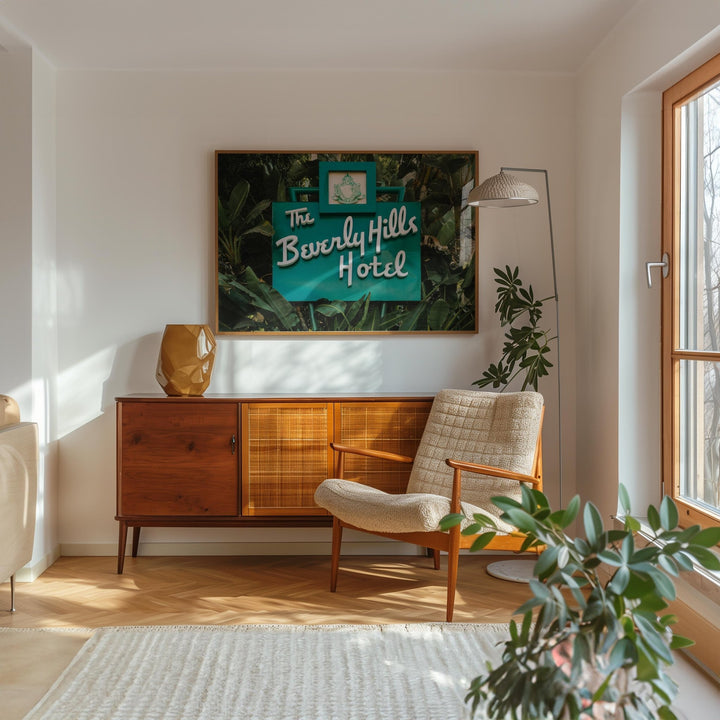 Living room with wooden sideboard, armchair, and decorative sign on wall