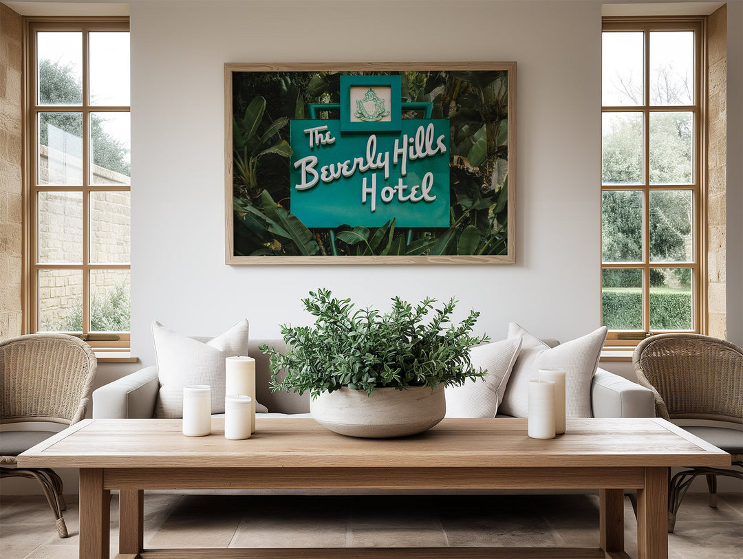 Living room with a picture of The Beverly Hills Hotel on the wall.