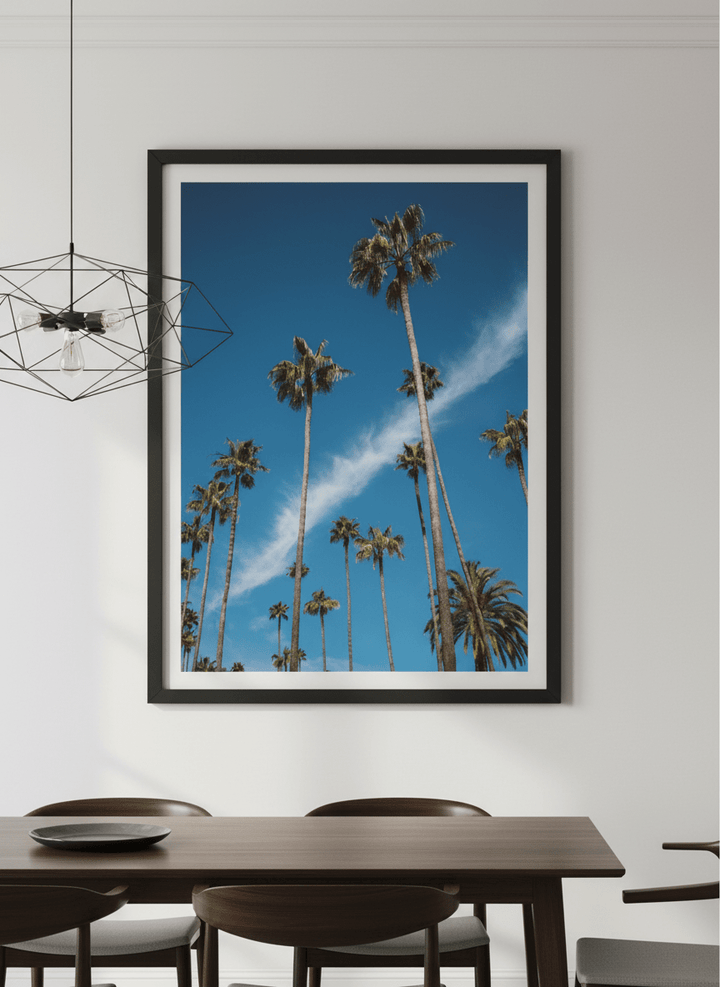 Wall art styled above a dining table in a contemporary home