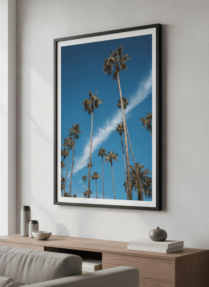 Modern wall art styled above a sofa in a neutral living room