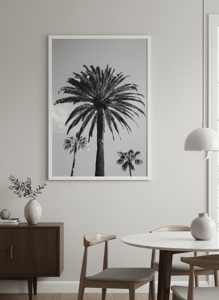 Wall art styled above a dining table in a contemporary home