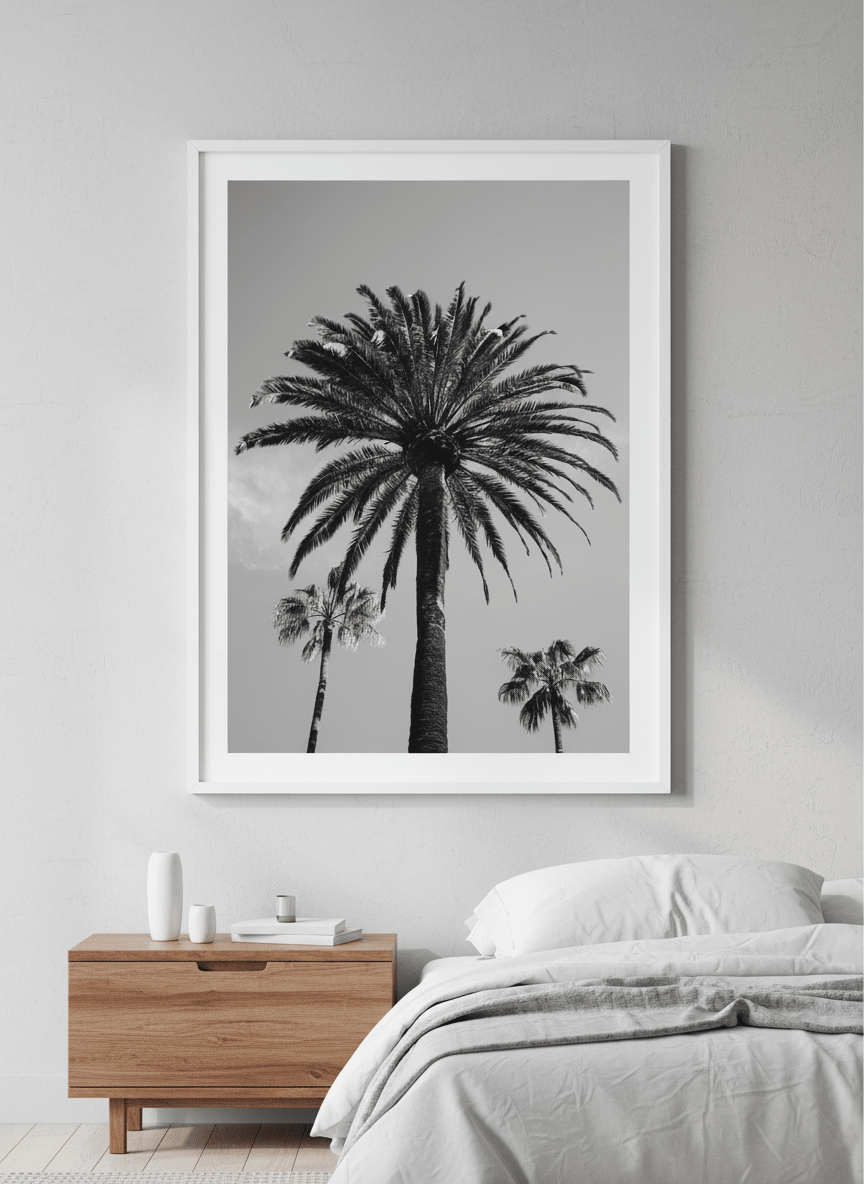 Minimalist artwork displayed in a calm, light-filled bedroom interior