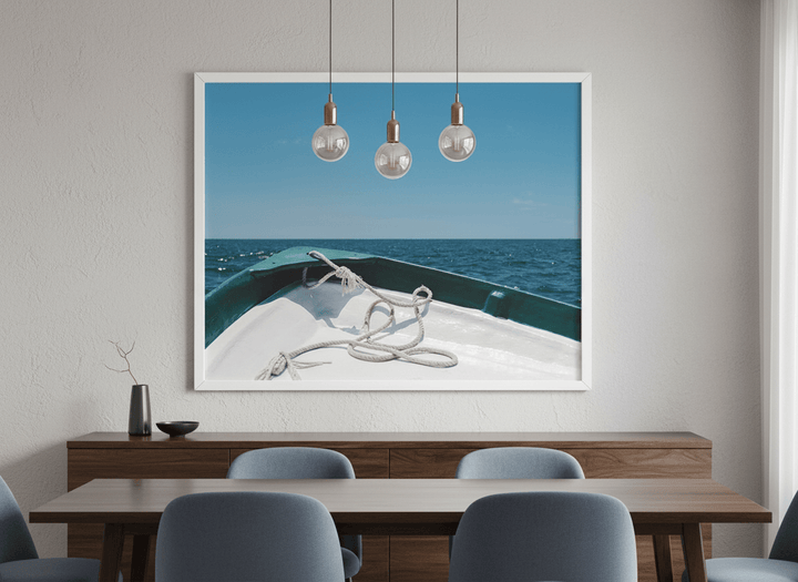 Wall art styled above a dining table in a contemporary home