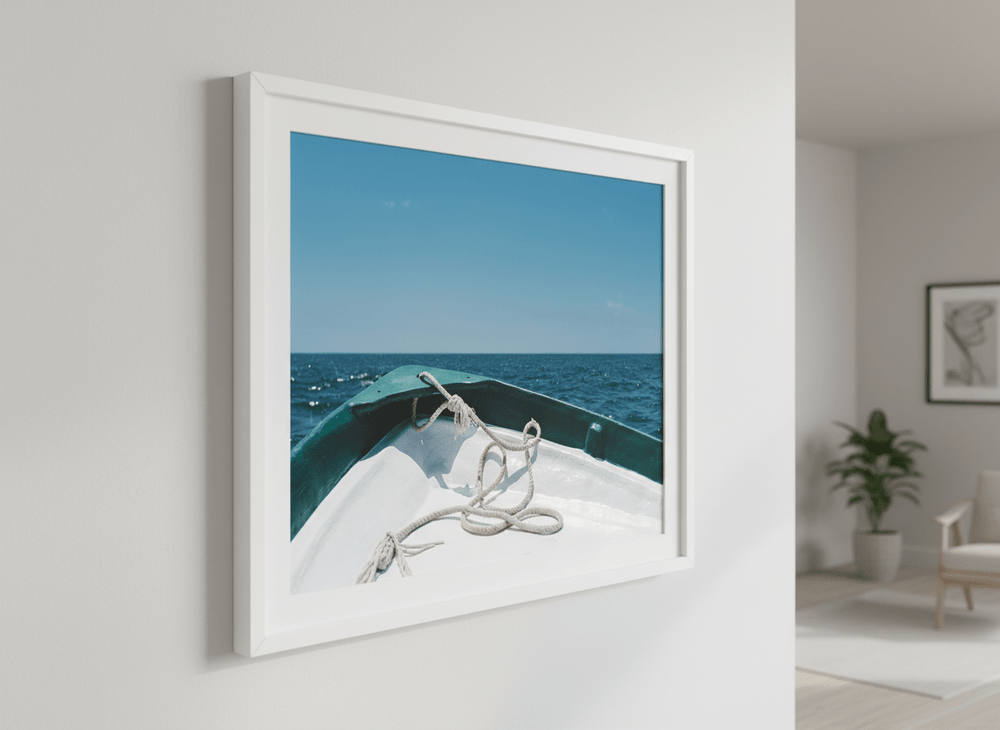 Modern wall art styled above a sofa in a neutral living room
