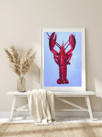 Modern wall art print standing on a console in a coastal dining room
