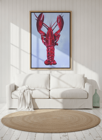 Oversized statement canvas wall art with a natural timber surround styled on the wall in a coastal living room