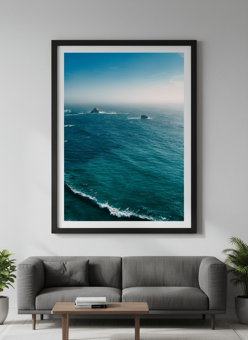 Modern wall art styled above a sofa in a neutral living room