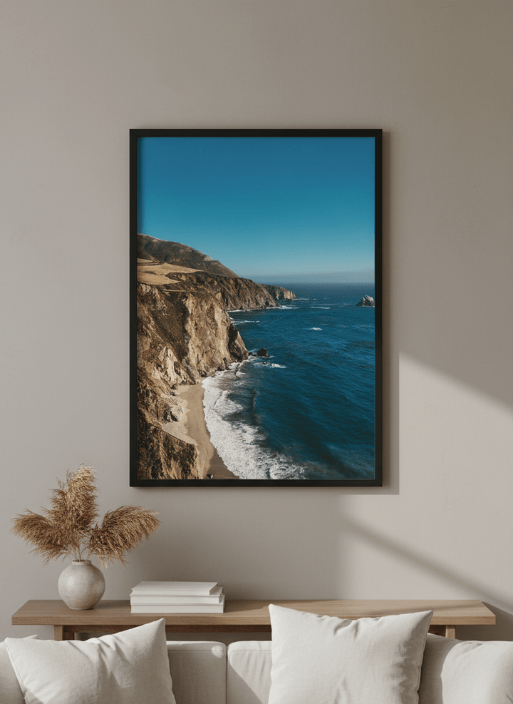 Modern wall art styled above a sofa in a neutral living room